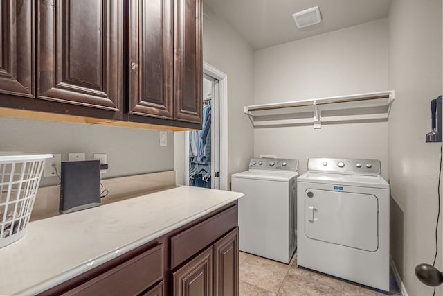 1109 Mount Ln, Rhome, TX 76078 - laundry area with cabinet space and washer and dryer