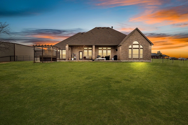 1109 Mount Ln, Rhome, TX 76078 - back of house with brick siding, roof with shingles, and a patio area