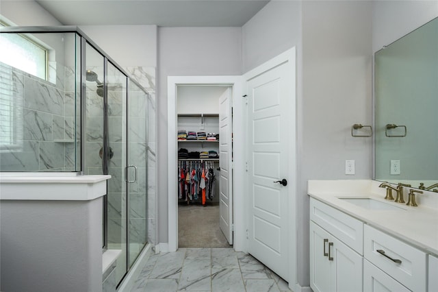 4008 Rochelle St, Celina, TX 75009 - bathroom featuring marble finish flooring, a shower stall, vanity, and a walk in closet