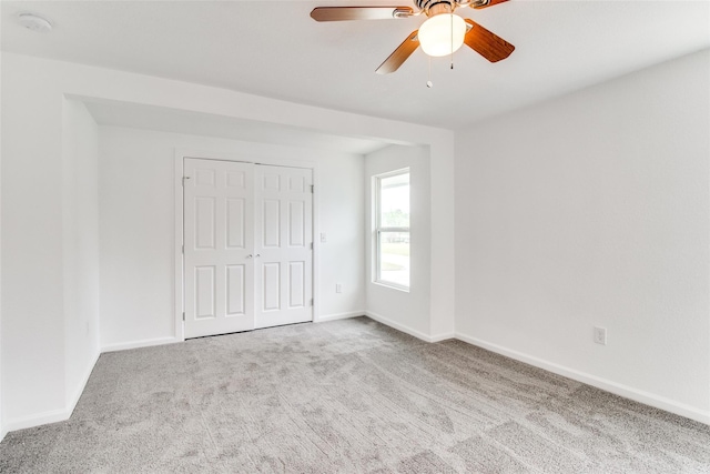 309 W Monterey St, Denison, TX 75020 - unfurnished bedroom with a closet, carpet, baseboards, and ceiling fan