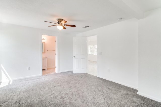 309 W Monterey St, Denison, TX 75020 - carpeted spare room featuring visible vents, baseboards, and a ceiling fan