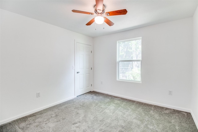 309 W Monterey St, Denison, TX 75020 - unfurnished room with carpet flooring, baseboards, and a ceiling fan