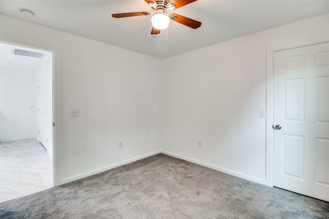 309 W Monterey St, Denison, TX 75020 - carpeted empty room with baseboards, a ceiling fan, and visible vents