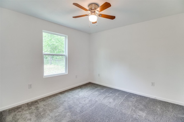 309 W Monterey St, Denison, TX 75020 - spare room featuring carpet, baseboards, and a ceiling fan
