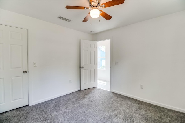 309 W Monterey St, Denison, TX 75020 - empty room featuring visible vents, ceiling fan, baseboards, and carpet floors