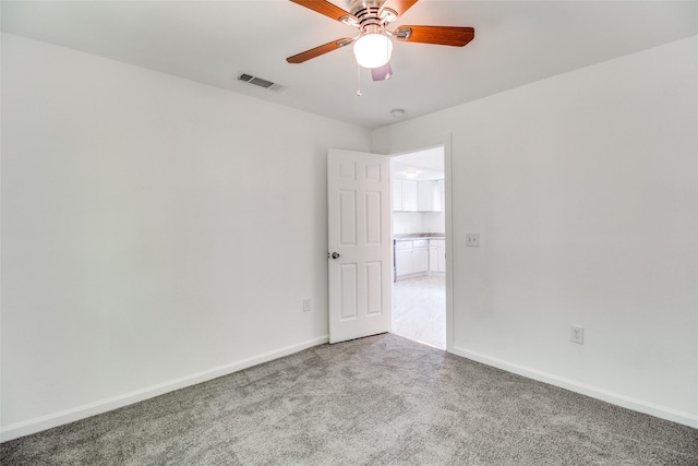 309 W Monterey St, Denison, TX 75020 - spare room featuring visible vents, baseboards, a ceiling fan, and carpet flooring
