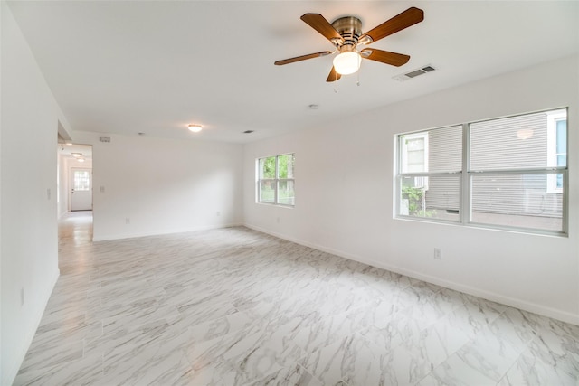 309 W Monterey St, Denison, TX 75020 - unfurnished room with visible vents, baseboards, and marble finish floor