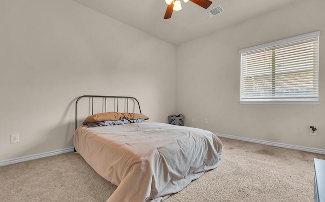 bedroom with carpet floors, baseboards, a ceiling fan, and visible vents