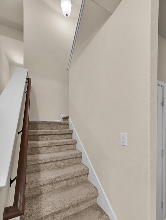 stairway with baseboards