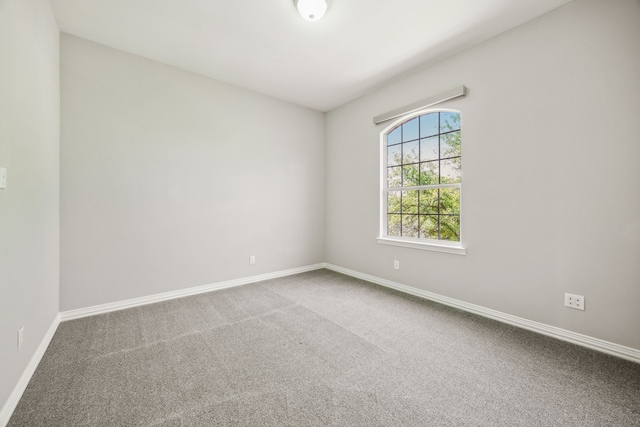 9892 Ranchero Dr, Frisco, TX 75033 - carpeted spare room featuring baseboards