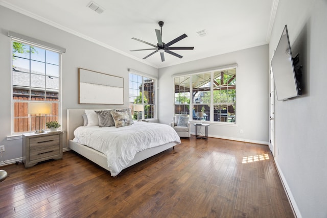 9892 Ranchero Dr, Frisco, TX 75033 - bedroom with crown molding, baseboards, dark wood finished floors, and visible vents