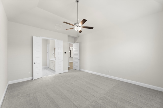 3723 Lochwood Dr, Rowlett, TX 75088 - unfurnished bedroom featuring light carpet, baseboards, ensuite bath, and ceiling fan