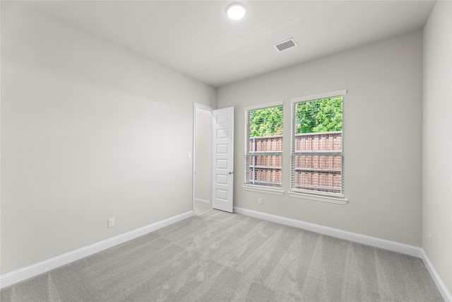 3723 Lochwood Dr, Rowlett, TX 75088 - spare room featuring baseboards and light carpet
