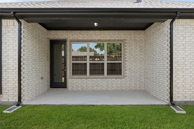 3723 Lochwood Dr, Rowlett, TX 75088 - property entrance with a shingled roof and brick siding