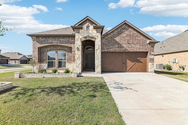13412 Cortes De Pallas Dr, Little Elm, TX 75068 - french country home with stone siding, brick siding, concrete driveway, and a garage