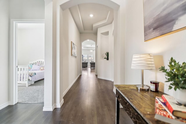 13412 Cortes De Pallas Dr, Little Elm, TX 75068 - corridor with arched walkways, dark wood-style floors, and a raised ceiling