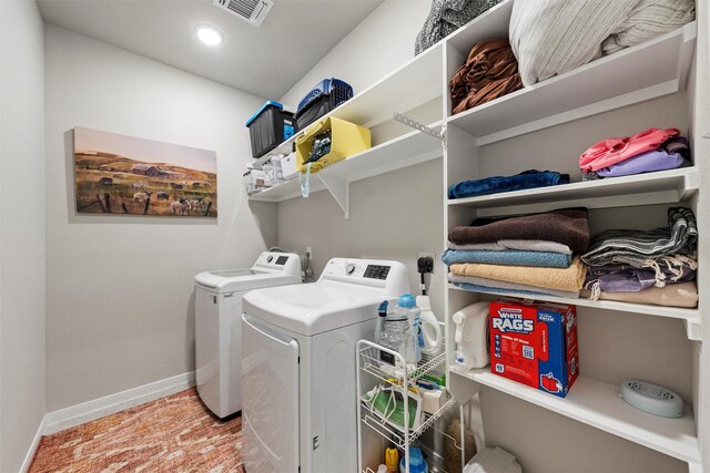 clothes washing area with visible vents, baseboards, separate washer and dryer, laundry area, and recessed lighting