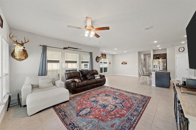 living area with recessed lighting, light tile patterned floors, visible vents, and ceiling fan