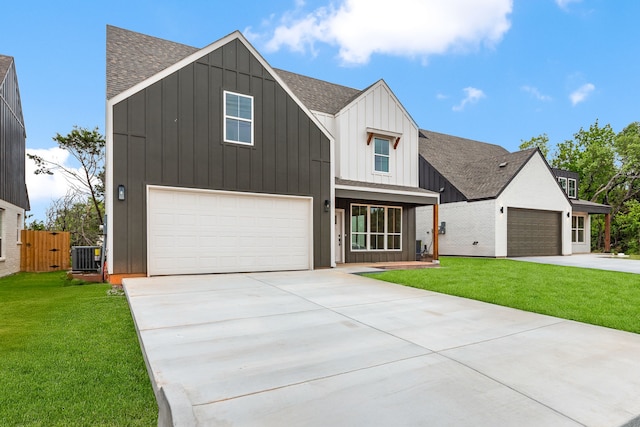 5703 Barkridge Dr, Granbury, TX 76048 - modern farmhouse style home featuring roof with shingles, driveway, board and batten siding, a front yard, and a garage
