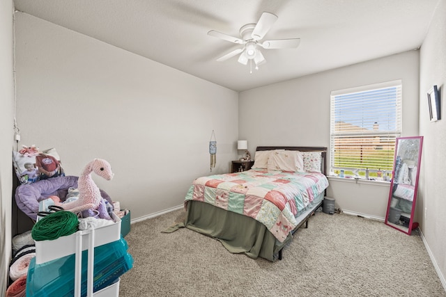 bedroom with carpet, baseboards, and a ceiling fan