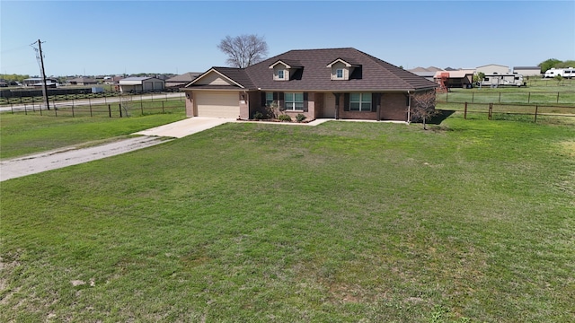 view of front facade featuring concrete driveway, a front yard, fence, and a garage