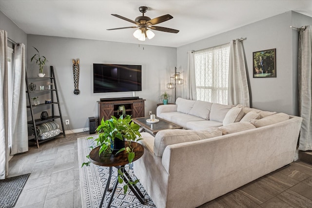 12550 Burninglog Ln, Dallas, TX 75243 - living room with baseboards and a ceiling fan