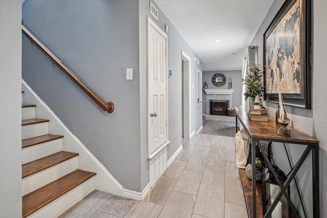 12550 Burninglog Ln, Dallas, TX 75243 - corridor featuring baseboards, stairs, light tile patterned floors, and visible vents