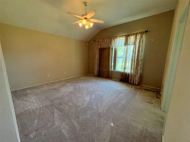 132 Yosemite Ln, Terrell, TX 75160 - empty room with lofted ceiling, a ceiling fan, carpet, and baseboards