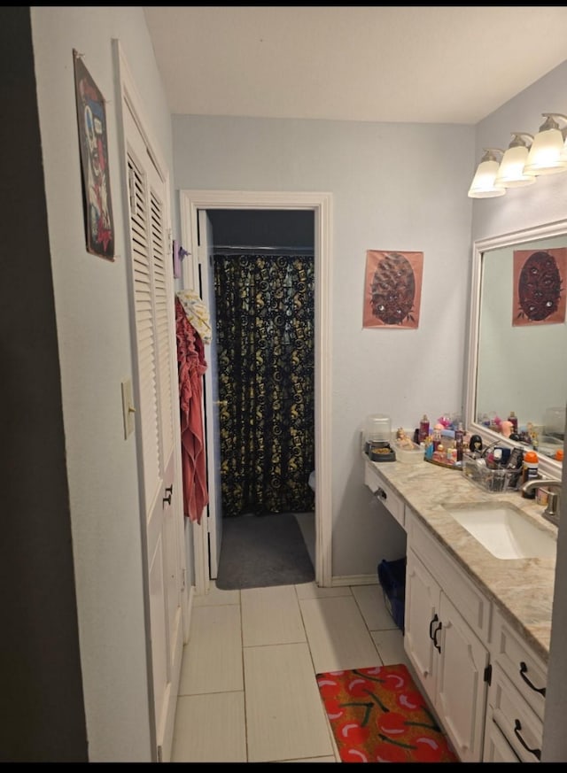 221 Azalea Dr, Sulphur Springs, TX 75482 - full bath with vanity, tile patterned floors, a closet, toilet, and baseboards