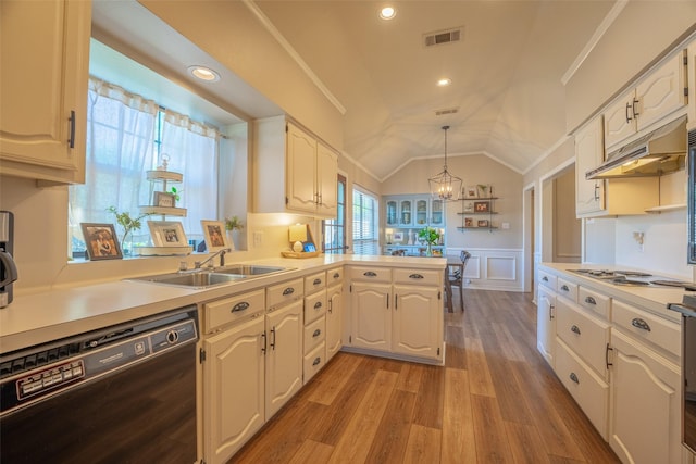 kitchen featuring black dishwasher, a sink, under cabinet range hood, crown molding, and lofted ceiling