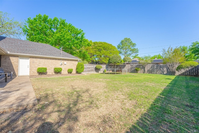 view of yard with a fenced backyard