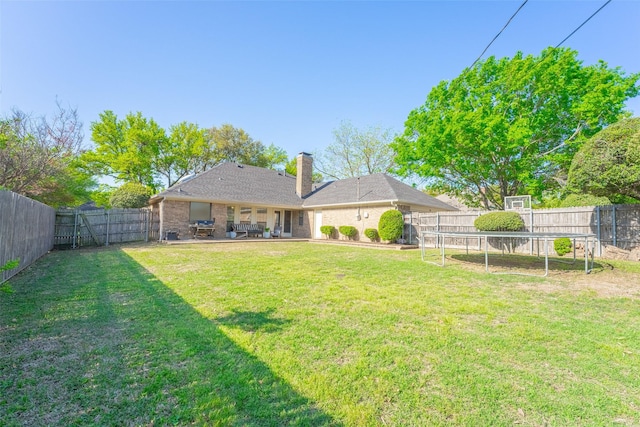 view of yard with a patio and a fenced backyard