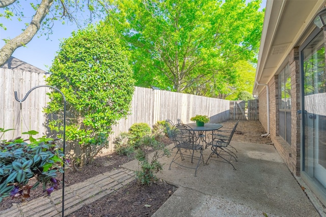 view of patio / terrace with outdoor dining space and a fenced backyard