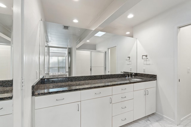 4122 Travis St Unit 7, Dallas, TX 75204 - full bathroom featuring double vanity, marble look tiles, recessed lighting, and a shower stall