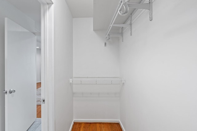 4122 Travis St Unit 7, Dallas, TX 75204 - walk in closet featuring wood finished floors