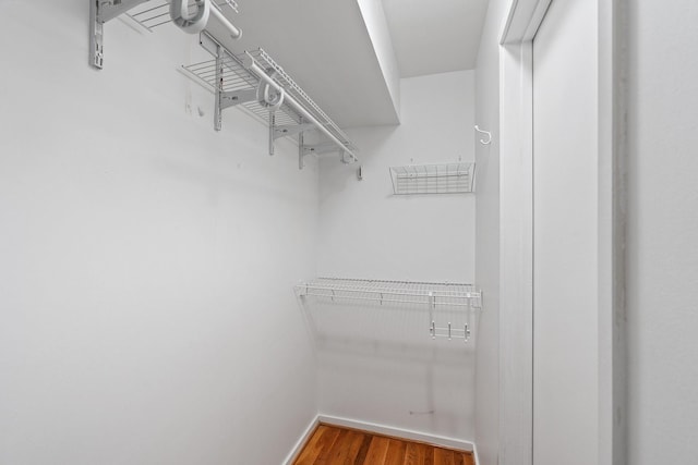 4122 Travis St Unit 7, Dallas, TX 75204 - walk in closet with wood finished floors