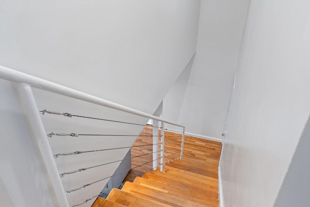4122 Travis St Unit 7, Dallas, TX 75204 - stairway with wood finished floors and baseboards