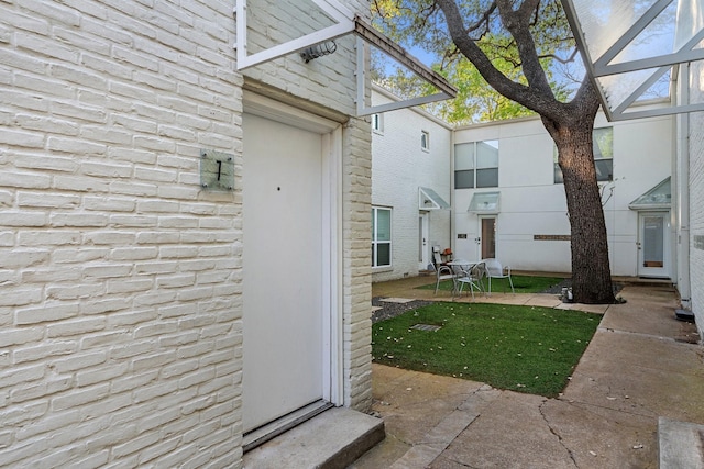 4122 Travis St Unit 7, Dallas, TX 75204 - doorway to property featuring brick siding