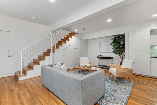 4122 Travis St Unit 7, Dallas, TX 75204 - living room with stairway, light wood-type flooring, and recessed lighting
