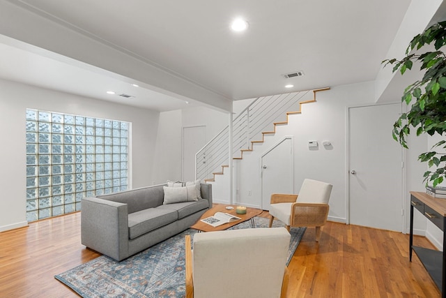 4122 Travis St Unit 7, Dallas, TX 75204 - living area featuring stairs, light wood-type flooring, and recessed lighting