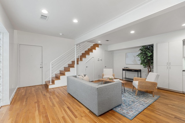 4122 Travis St Unit 7, Dallas, TX 75204 - living room with stairs, light wood-style floors, and recessed lighting