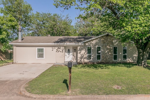 1807 Lachelle Ln, Arlington, TX 76010 - view of front of house with concrete driveway, a front lawn, and stone siding