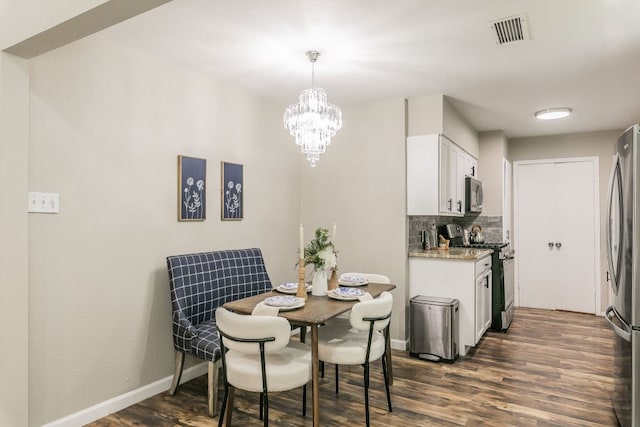 1807 Lachelle Ln, Arlington, TX 76010 - dining space with dark wood-type flooring, a chandelier, and baseboards