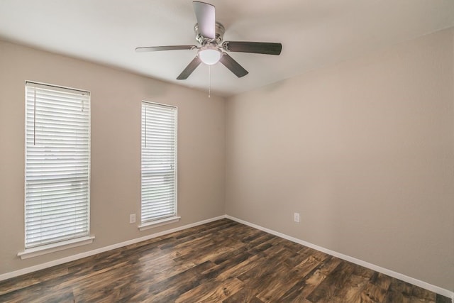 1807 Lachelle Ln, Arlington, TX 76010 - empty room featuring dark wood-style floors, baseboards, ceiling fan, and healthy amount of natural light