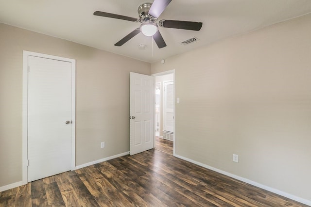 1807 Lachelle Ln, Arlington, TX 76010 - unfurnished bedroom with wood finished floors, baseboards, and a ceiling fan