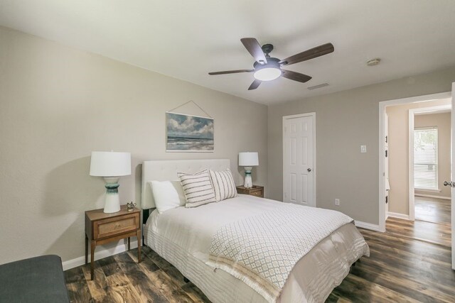 1807 Lachelle Ln, Arlington, TX 76010 - bedroom featuring baseboards, dark wood-type flooring, and ceiling fan