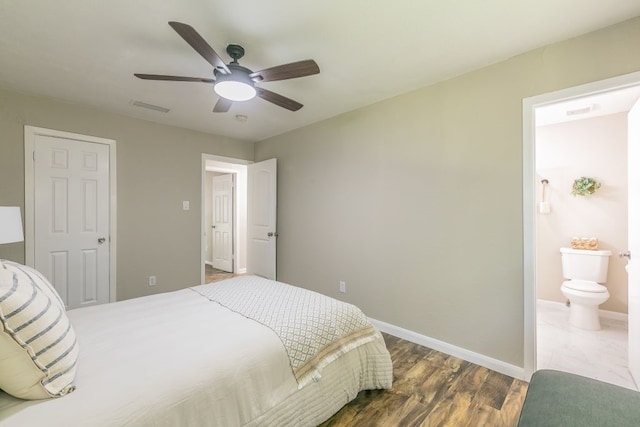 1807 Lachelle Ln, Arlington, TX 76010 - bedroom featuring ensuite bath, wood finished floors, baseboards, and ceiling fan