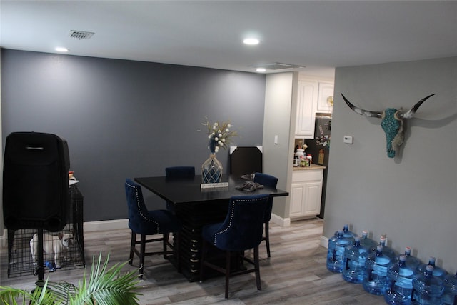 12824 Kingsgate Dr, Rhome, TX 76078 - dining room with light wood-type flooring, baseboards, visible vents, and recessed lighting