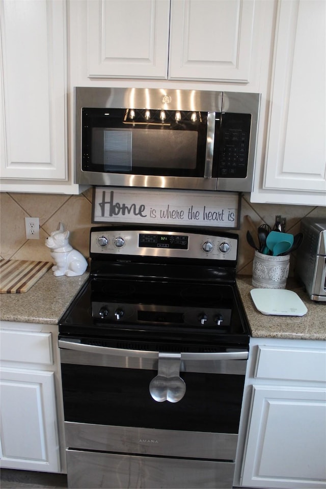 12824 Kingsgate Dr, Rhome, TX 76078 - kitchen with white cabinetry, backsplash, and stainless steel appliances
