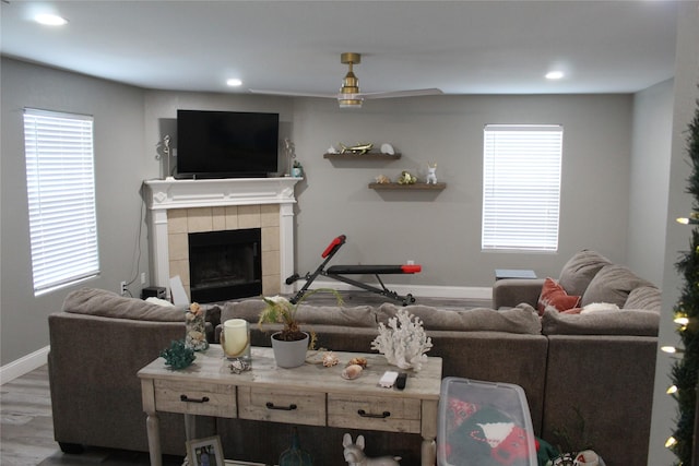 12824 Kingsgate Dr, Rhome, TX 76078 - living room featuring recessed lighting, a tiled fireplace, baseboards, and wood finished floors